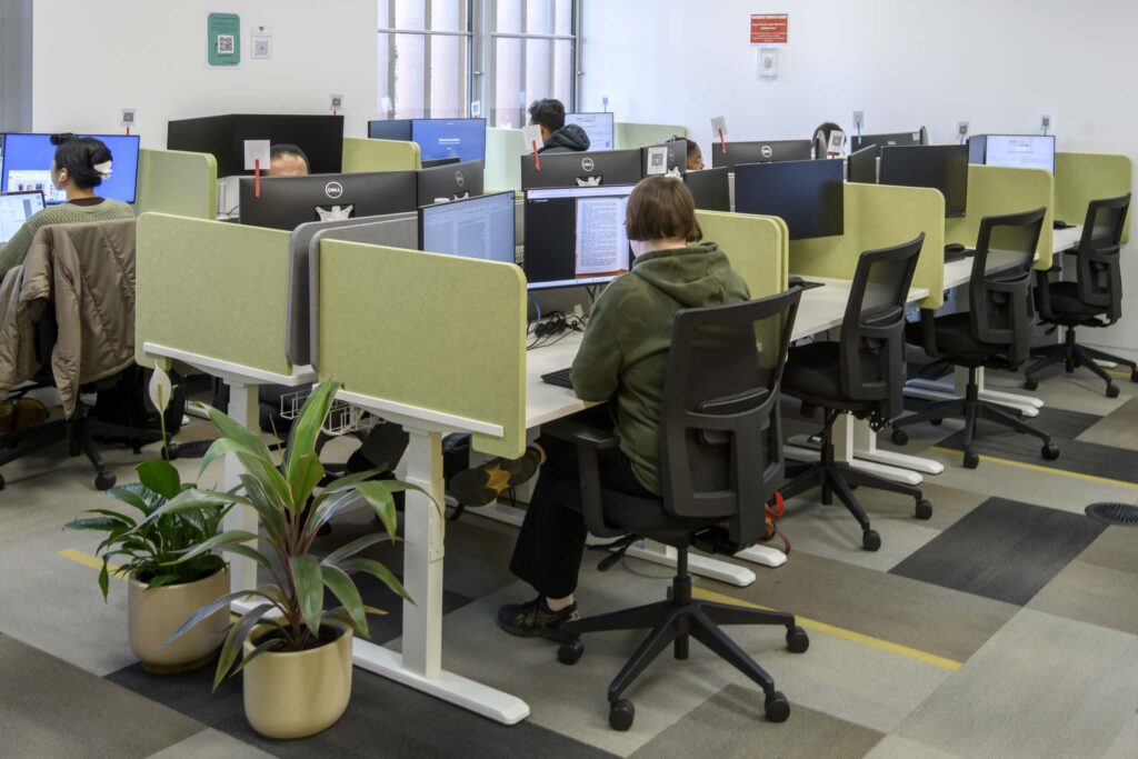 Students working quietly at computers in the shared study space at the Melton Suburban University Study Hub.